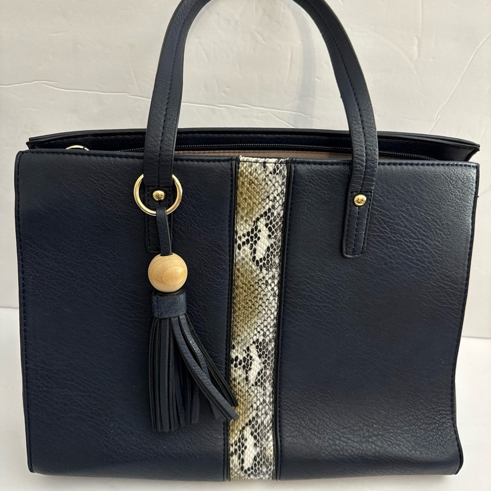 Superbia Italy Faux leather Navy purse with tassell on handle. Gold trim.